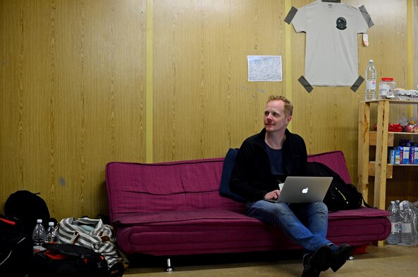 Patrick van Dam, a Dutch freelance photographer and graphic designer, edits images while on a flying training deployment with the 493rd Fighter Squadron at Ämari Air Base, Estonia, Aug. 16, 2016. Van Dam has been designing and producing patches for the squadron for 15 years, and has created approximately 25 patch designs. The 493rd is out of Royal Air Force Lakenheath, England. (U.S. Air Force photo by Senior Airman Erin Trower/Released)