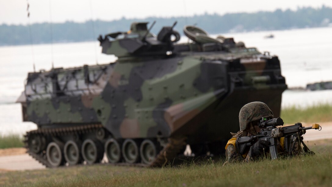 A Marine with 4th Assault Amphibian Battalion, 4th Marine Division, Marine Forces Reserve, provides security for his amphibious assault vehicle at Camp Grayling Joint Maneuver Training Center, Mich., Aug. 17, 2016. The exercise also included infantry training techniques and military operations in urban terrain.  Exercise Northern Strike Northern Strike 16 is a National Guard Bureau-sponsored exercise uniting approximately 5,000 Army, Air Force, Marine, and Special Forces service members from 20 states and three coalition countries. The exercise strives to provide accessible, readiness-building opportunities for military units from all service branches to achieve and sustain proficiency in conducting mission command, air, sea, and ground maneuver integration, and the synchronization of fires in a joint, multinational, decisive action environment.