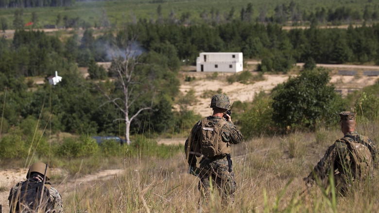 Marines with 4th Assault Amphibian Battalion, 4th Marine Division, Marine Forces Reserve, provide fire support by calling in movements and attacks during Exercise Northern Strike 2016 at Camp Grayling Joint Maneuver Training Center, Mich., Aug. 17, 2016. Exercise Northern Strike 16 is a National Guard Bureau-sponsored exercise uniting approximately 5,000 Army, Air Force, Marine, and Special Forces service members from 20 states and three coalition countries. The exercise strives to provide accessible, readiness-building opportunities for military units from all service branches to achieve and sustain proficiency in conducting mission command, air, sea, and ground maneuver integration, and the synchronization of fires in a joint, multinational, decisive action environment.