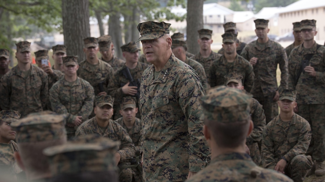 Gen. Robert B. Neller, Commandant of the Marine Corps, speaks with a group of Marines from Marine Forces Reserve about the importance of their training during Exercise Northern Strike 2016 at Camp Grayling Joint Maneuver Training Center, Mich., Aug. 17, 2016. The CMC visited exercise Northern Strike to observe the Marines and their training.  Exercise Northern Strike Northern Strike 16 is a National Guard Bureau-sponsored exercise uniting approximately 5,000 Army, Air Force, Marine, and Special Forces service members from 20 states and three coalition countries. The exercise strives to provide accessible, readiness-building opportunities for military units from all service branches to achieve and sustain proficiency in conducting mission command, air, sea, and ground maneuver integration, and the synchronization of fires in a joint, multinational, decisive action environment.