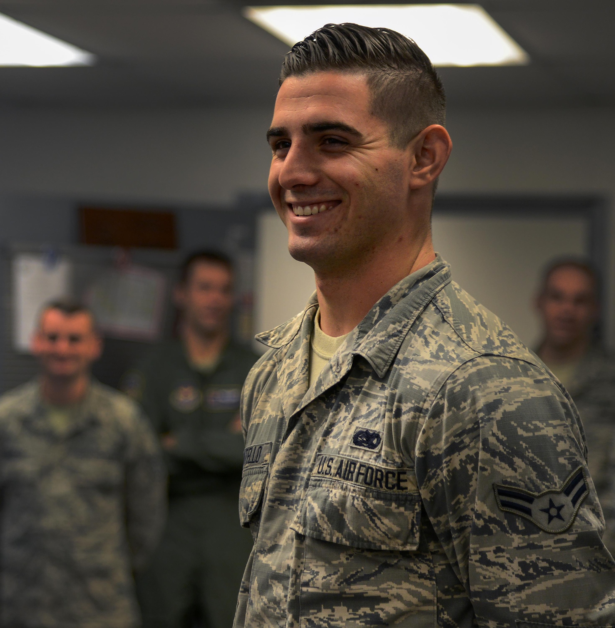 Airman 1st Class Justin Montello, 47th Operation Support Squadron airfield systems apprentice, smilies after learning about his award on Laughlin Air Force Base, Texas, Aug. 17, 2016. Montello was chosen by wing leadership as this week’s XLer. (U.S. Air Force photo/Senior Airman Ariel D. Partlow)
