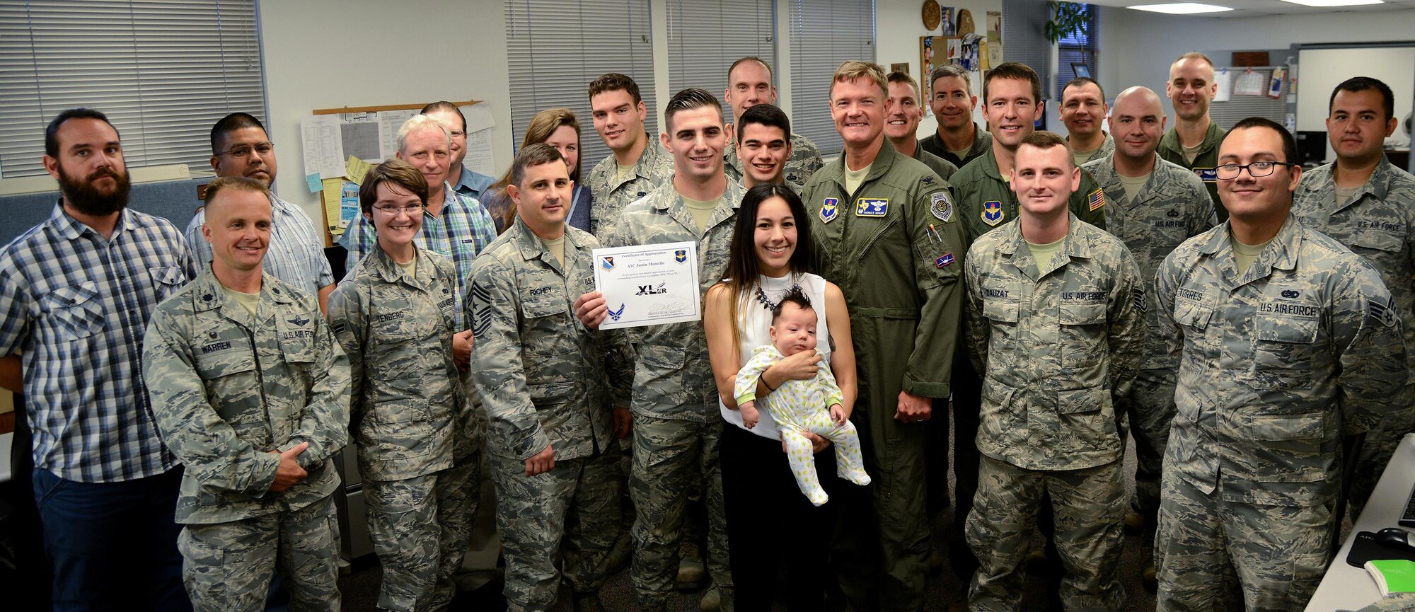 Airman 1st Class Justin Montello, 47th Operation Support Squadron airfield systems apprentice, smilies after learning about his award on Laughlin Air Force Base, Texas, Aug. 17, 2016. Montello was chosen by wing leadership as this week’s XLer. (U.S. Air Force photo/Senior Airman Ariel D. Partlow)