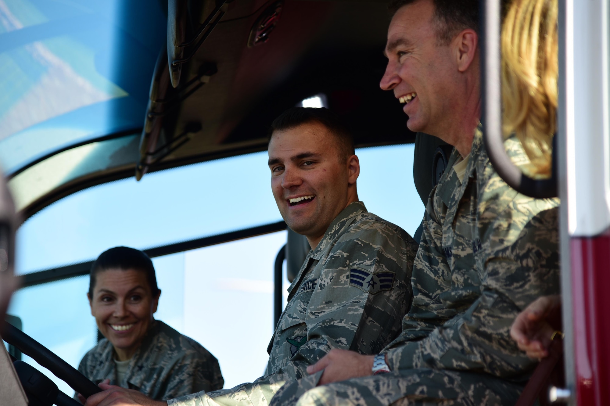 PETERSON AIR FORCE BASE, Colo. - Brig. Gen. Chad Franks, 14th Air Force vice commander, and Brig. Gen. Pamela Lincoln, 14th Air Force mobilization assistant to the commander, are briefed by Senior Airman Anthony Pipes, 21st Civil Engineer firefighter, on the controls for the water canon attached to one of the flightline crash tender trucks on Peterson Air Force Base, Colo., Aug. 16, 2016. The crash tender is a specialized fire engine designed for use in aircraft rescues. The high-pressure nozzle is used to penetrate an aircraft’s fuselage in order to fight the fire.  (U.S. Air Force photo by Staff Sgt. Amber Grimm) 