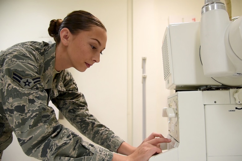Airman 1st Class Rachael O’Keefe, 21st Medical Support Squadron radiology technologist, adjusts the height of the X-ray tube at Peterson Air Force Base, Colo., Aug. 22, 2016. O’Keefe underwent 14 months of technical training. (U.S. Air Force photo by Dave Meade)
