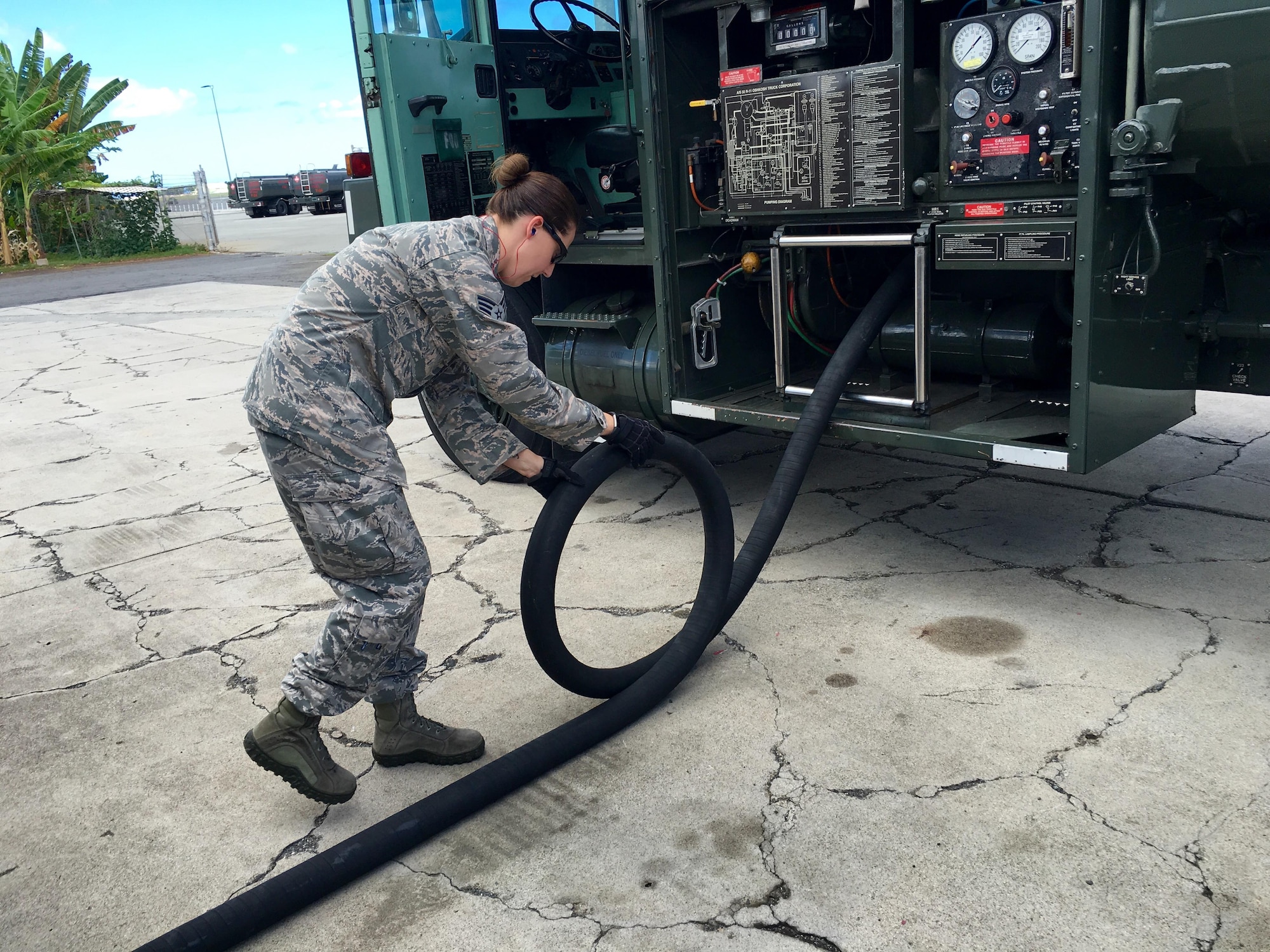 Senior Airman Elizabeth Bingham, fuels specialist in the 419th Logistics Readiness Squadron, checks a fuel hose during a routine maintenance inspection. Five reservists from the 419th LRS fuel shop trained at Joint Base Pearl Harbor-Hickam, Hawaii, for two weeks as part of their annual training requirement, refueling a wide variety of joint service aircraft. (U.S. Air Force photo/Bryan Magaña)