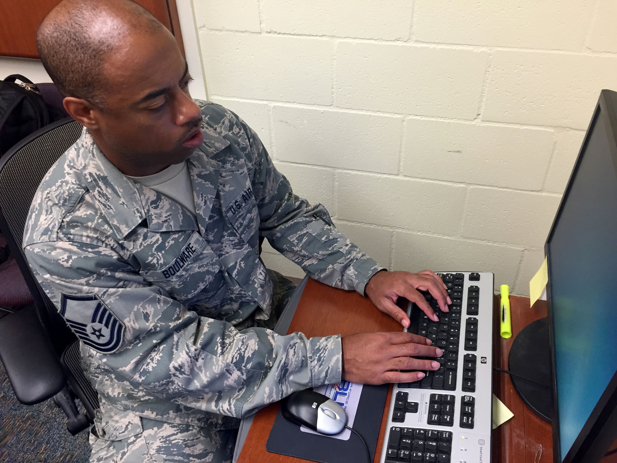 Master. Sgt. George Boulware, 419th Force Support Squadron, works to keep computers operational during two weeks of annual tour training at Joint Base Pearl Harbor-Hickam located on the island of Oahu, Hawaii. (U.S. Air Force photo/Kari Tilton)