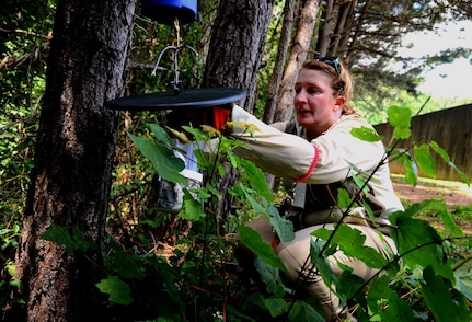 Kathleen Schmidt, Georgia Department of Public Health vector surveillance coordinator, lays traps at the firing range at Dobbins Air Reserve Base, Ga., on June 24, 2016. Schmidt came to Dobbins as part of a Department of Defense intiative to help comabt the Zika virus. (U.S. Air Force photo by Staff Sgt. Daniel Phelps)