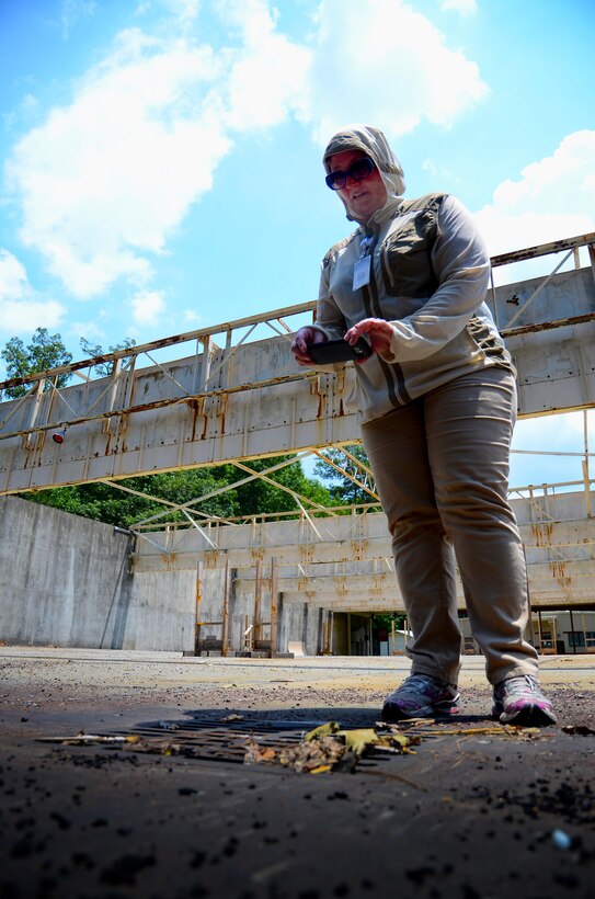 Kathleen Schmidt, Georgia Department of Public Health vector surveillance coordinator, lays traps at the firing range at Dobbins Air Reserve Base, Ga., on June 24, 2016. Schmidt came to Dobbins as part of a Department of Defense intiative to help comabt the Zika virus. (U.S. Air Force photo by Staff Sgt. Daniel Phelps) 