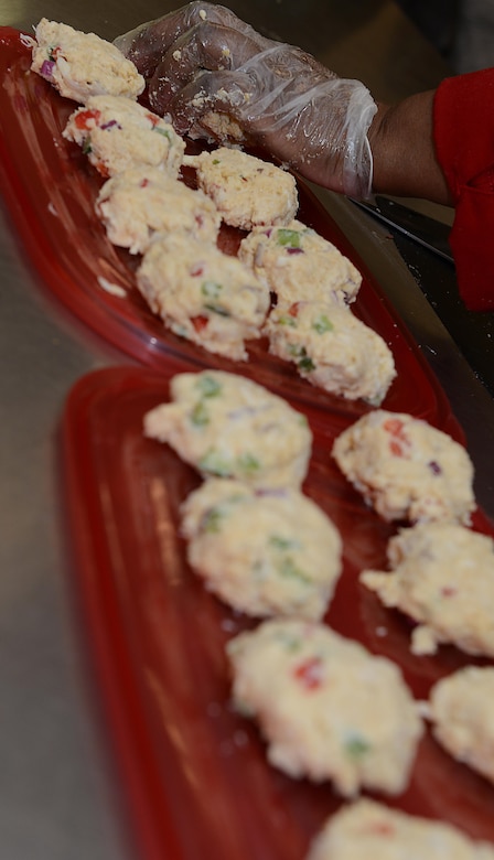 Sonnica Jones prepares a batch of crab cakes during a cooking class at the Community Commons at Langley Air Force Base, Va., Aug. 16, 2016. Class participants helped cook various menu items and then had the opportunity to taste them. (U.S. Air Force photo by Staff Sgt. Teresa J. Cleveland)