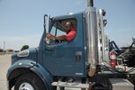 Roderick Cato, 502nd Logistic Readiness Squadron motor vehicle operator, prepares to drive a tractor trailer Aug. 12 at Joint Base San Antonio-Randolph. The 502nd LRS vehicle operations consists of 198 active-duty members, Department of Defense civilians and contractors who help serve 266 mission partners throughout JBSA. The department has 350 vehicles in its inventory, including buses, sedans, vans, trucks, tractor-trailers, wrecker recovery vehicles and forklifts.