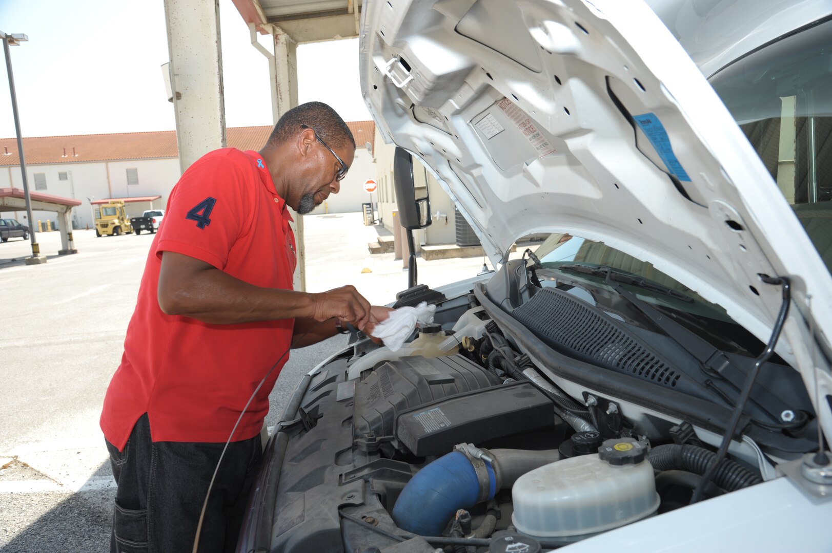 Matthew Callender, 502nd Logistic Readiness Squadron motor vehicle operator, checks the oil level of a van Aug. 12 at JBSA-Randolph. The 502nd LRS vehicle operations consists of 198 active-duty members, Department of Defense civilians and contractors who help serve 266 mission partners throughout JBSA. The department has 350 vehicles in its inventory, including buses, sedans, vans, trucks, tractor-trailers, wrecker recovery vehicles and forklifts.