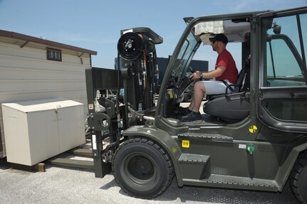 Jerry Watson, 502nd Logistic Readiness Squadron motor vehicle operator, operates a forklift to move a container Aug. 12 at Joint Base San Antonio-Randolph. The 502nd LRS vehicle operations consists of 198 active-duty members, Department of Defense civilians and contractors who help serve 266 mission partners throughout JBSA. The department has 350 vehicles in its inventory, including buses, sedans, vans, trucks, tractor-trailers, wrecker recovery vehicles and forklifts.