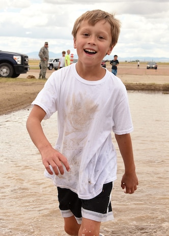 Children of families assigned to the 341st Missile Wing participated in the base’s first mud run hosted by the 341st Maintenance Group Aug. 19, 2016, at Malmstrom Air Force Base, Mont. The event was split between adults and children, to maintain the integrity of the competitive aspect with different events for each group. (U.S. Air Force photo/Senior Airman Jaeda Tookes)