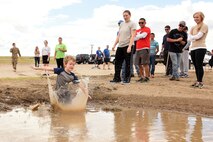 Children of families assigned to the 341st Missile Wing participated in the base’s first mud run hosted by the 341st Maintenance Group Aug. 19, 2016, at Malmstrom Air Force Base, Mont. The children’s event started behind the fire station and included a sand bag carry and a one mile run which ended in a mud pit. (U.S. Air Force photo/Senior Airman Jaeda Tookes)
