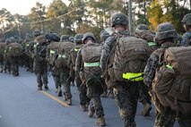 Marines with the Ground Combat Element Integrated Task Force conduct a combat conditioning hike aboard Marine Corps Base Camp Lejeune, North Carolina, Nov. 21, 2014. The task force hiked approximately 10-kilometers. The Marines carried a varied array of weapons; from standard M16A4 and M4 service rifles, to M240B machine guns, Mk-153 shoulder-launched multipurpose assault weapons and 60mm mortar systems, in addition to an assault fighting load. From October 2014 to July 2015, the Ground Combat Element Integrated Task Force will conduct individual and collective skills training in designated combat arms occupational specialties in order to facilitate the standards based assessment of the physical performance of Marines in a simulated operating environment performing specific ground combat arms tasks. (U.S. Marine Corps photo by Cpl. Paul S. Martinez/Released)