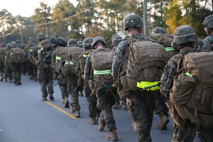 Marines with the Ground Combat Element Integrated Task Force conduct a combat conditioning hike aboard Marine Corps Base Camp Lejeune, North Carolina, Nov. 21, 2014. The task force hiked approximately 10-kilometers. The Marines carried a varied array of weapons; from standard M16A4 and M4 service rifles, to M240B machine guns, Mk-153 shoulder-launched multipurpose assault weapons and 60mm mortar systems, in addition to an assault fighting load. From October 2014 to July 2015, the Ground Combat Element Integrated Task Force will conduct individual and collective skills training in designated combat arms occupational specialties in order to facilitate the standards based assessment of the physical performance of Marines in a simulated operating environment performing specific ground combat arms tasks. (U.S. Marine Corps photo by Cpl. Paul S. Martinez/Released)