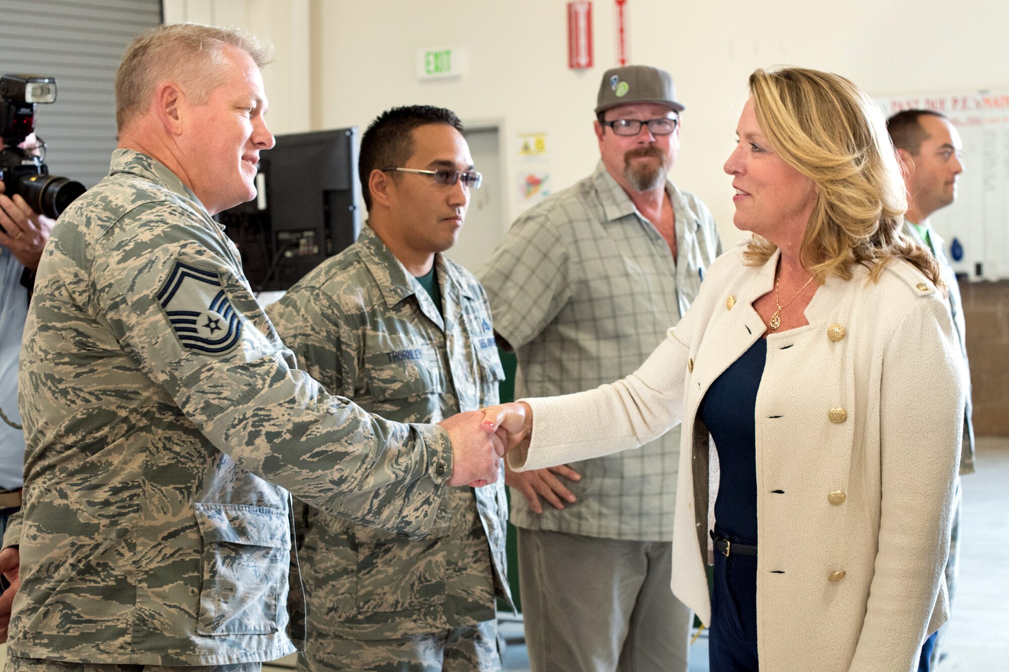 Secretary of the Air Force Deborah James, meets Senior Master Sgt. Daniel Wilson, 349th Maintenance Squadron, during a brief visit to Travis Air Force Base, Calif., August 19, 2016. James stopped at Travis during a trip to the Pacific Command area of responsibility, and took time to meet Citizen Airmen while her aircraft was refueled. (U.S. Air Force photo by Ken Wright)