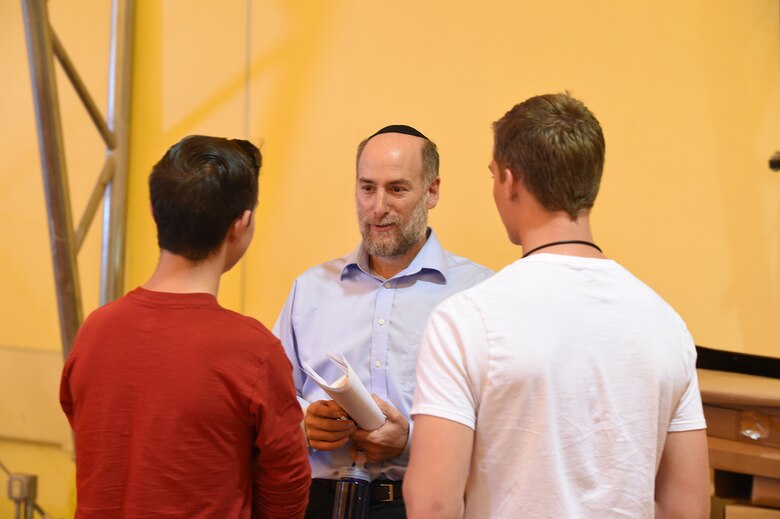 Ellicott High school students talk with guest speaker Joe Charnes after his speech during the Holocaust Remembrance Day at Schriever Air Force Base, Colorado, Tuesday, Aug. 23, 2016.  The event featured a question and answer session with Charnes. Charnes, a veteran and Jewish theologian who has been lecturing for years, helped setup the event’s “Holocaust museum” and continues to partner with Ellicott schools to educate youth on the Holocaust.(U.S. Air Force photo/Airman William Tracy)