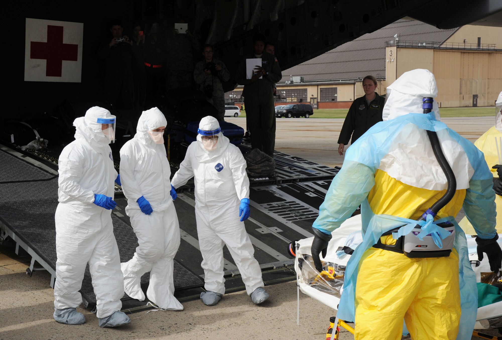 The Air Force District of Washington AFMS 79th Medical Wing and other military medical personnel assigned to Walter Reed National Military Medical Center transfers a simulated patient for further care at WRNMMC during the 2016 Mobility Solace Exercise, exercising the ability of military medics to safely transport patients with High Consequence Infectious Diseases, such as Ebola. The patient traveled to Joint Base Andrews from Joint Base Charleston via an Air Mobility Command C-17 Globemaster III transport aircraft. (U.S. Air Force/Jim Lotz)