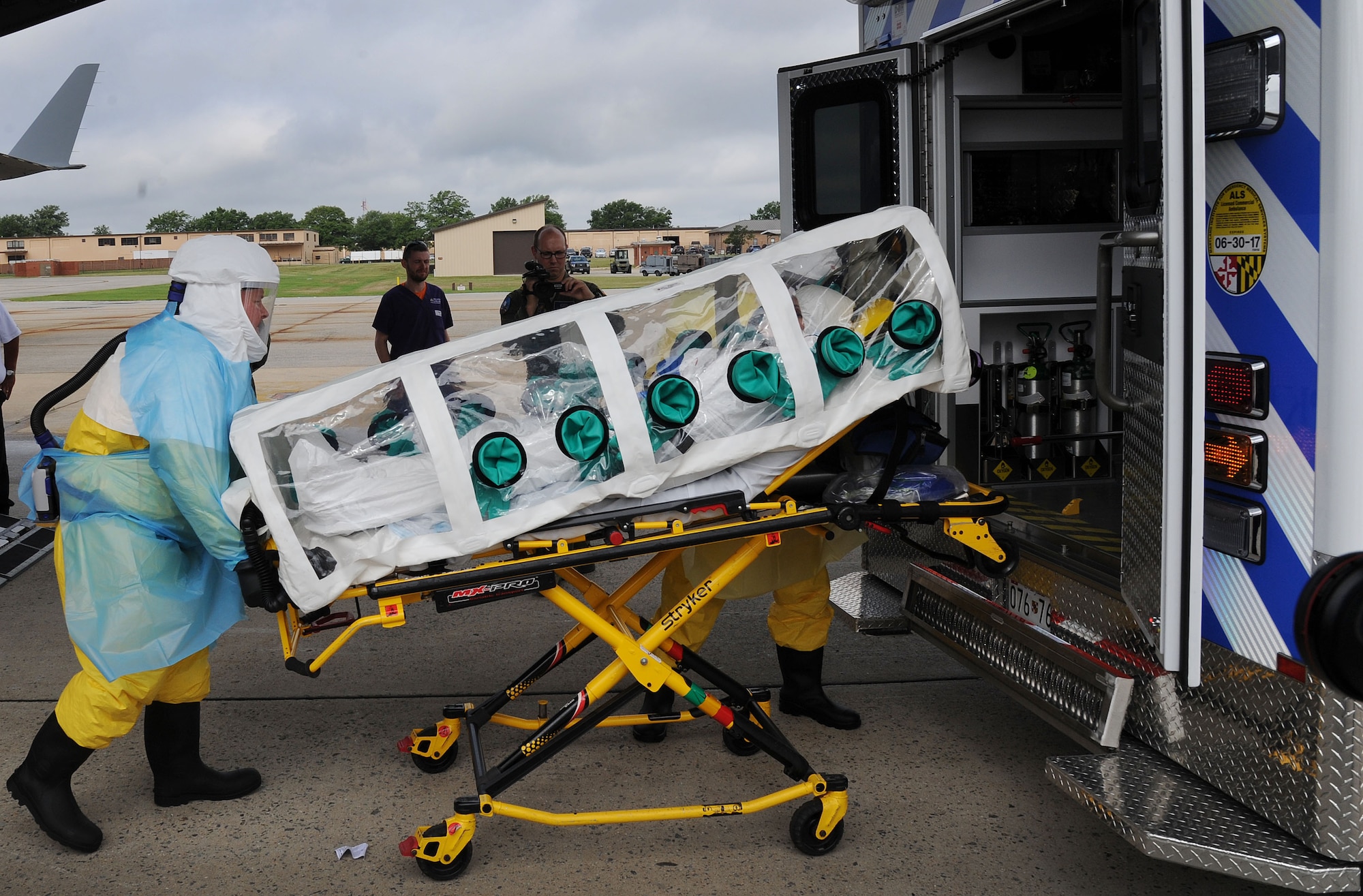 The Air Force District of Washington AFMS 79th Medical Wing and other military medical personnel assigned to Walter Reed National Military Medical Center transfers a simulated patient for further care at WRNMMC during the 2016 Mobility Solace Exercise, exercising the ability of military medics to safely transport patients with High Consequence Infectious Diseases, such as Ebola. The patient traveled to Joint Base Andrews from Joint Base Charleston via an Air Mobility Command 
C-17 Globemaster III transport aircraft. (U.S. Air Force/Jim Lotz)
