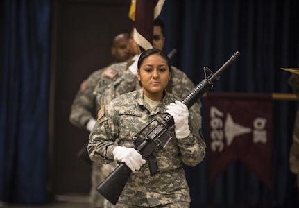 Army Reserve Soldiers on the 3297th United States Army Hospital Battalion Color Guard team march into the auditorium during the battalion's Color Casing Ceremony in Charlotte, N.C., Aug. 20. The unit will be officially deactivated Sept. 15 and will transition to become the 7409th U.S. Army Troop Medical Clinic. (U.S. Army Reserve photo by Sgt. 1st Class Brian Hamilton/ released)