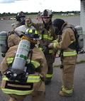 FORT MCCOY, Wis. – U.S. Army Reserve firefighter, Sgt. Kristopher Ayers, (center) fire chief with the 736th Firefighter Detachment, Granite City, Ill., prepares Wisconsin-based firefighters with the 923rd Firefighter Det. to conduct a search and rescue operation in a burn house during an exercise at Fort McCoy, Aug. 21, 2016. (U.S. Army Reserve Photo by Sgt. Quentin Johnson, 211th Mobile Public Affairs Detachment/Released)