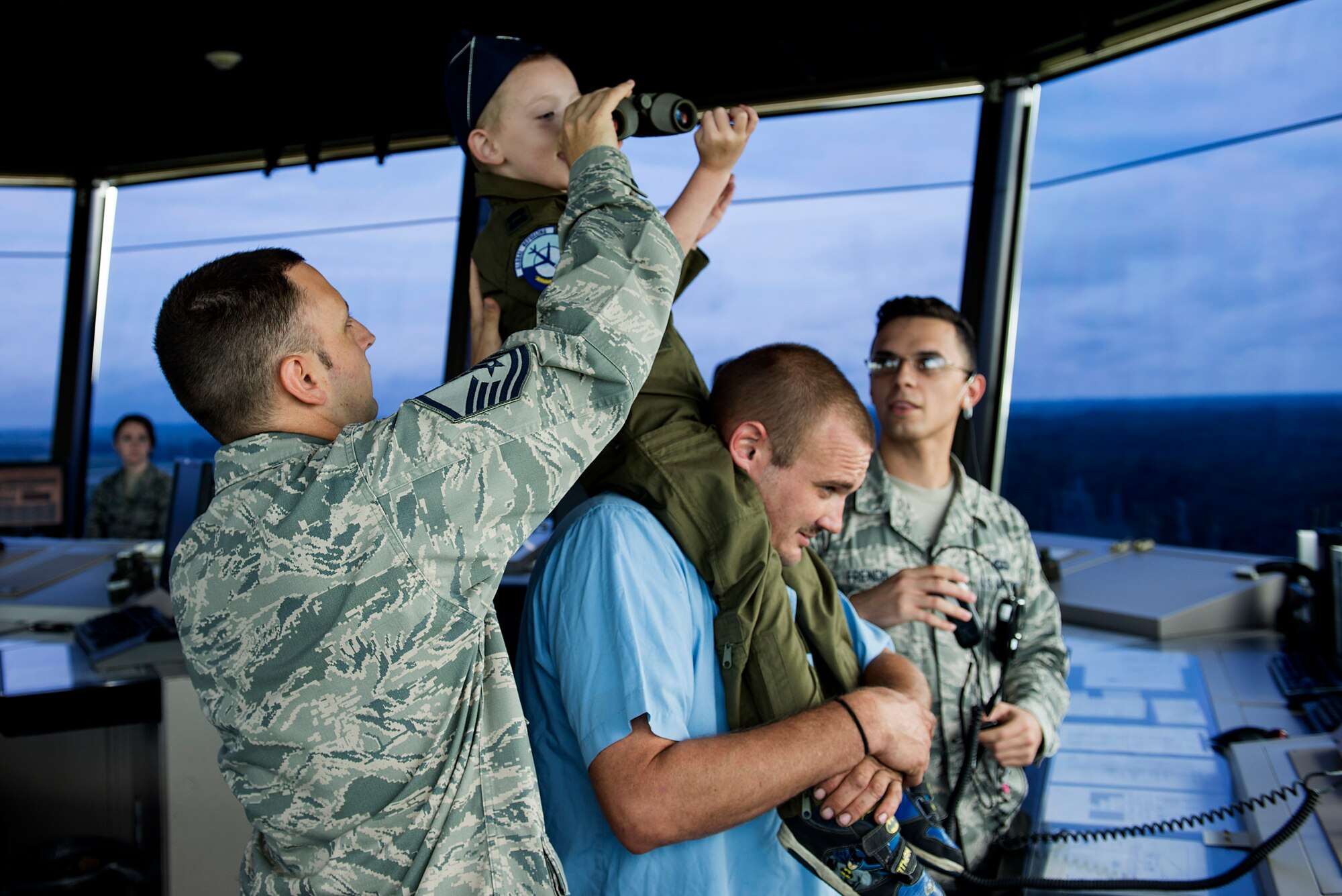 Hayden Brown, 6, looks out at the flightline from the control tower during his mission to help Batman find the Joker, Aug. 17, 2016, Scott Air Force Base, Ill. Scott Airmen teamed up with Alton VFW Post 1308 to present Hayden with a badge of courage for his determination in dealing with his rare, and terminal illness, known as MLD.  (U.S. Air Force photo by Senior Airman Megan Friedl)