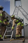 160821-A-CJ112-006
FORT MCCOY, Wis. – U.S. Army Reserve firefighters from the 923rd Firefighter Detachment, Sturtevant, Wis., secure a ladder to the side of the burn house before conducting a search and rescue operation during an exercise at Fort McCoy, Aug. 21, 2016. The training helped firefighters find weaknesses in their techniques, while learning new ones. (U.S. Army Reserve Photo by Sgt. Quentin Johnson, 211th Mobile Public Affairs Detachment/Released)