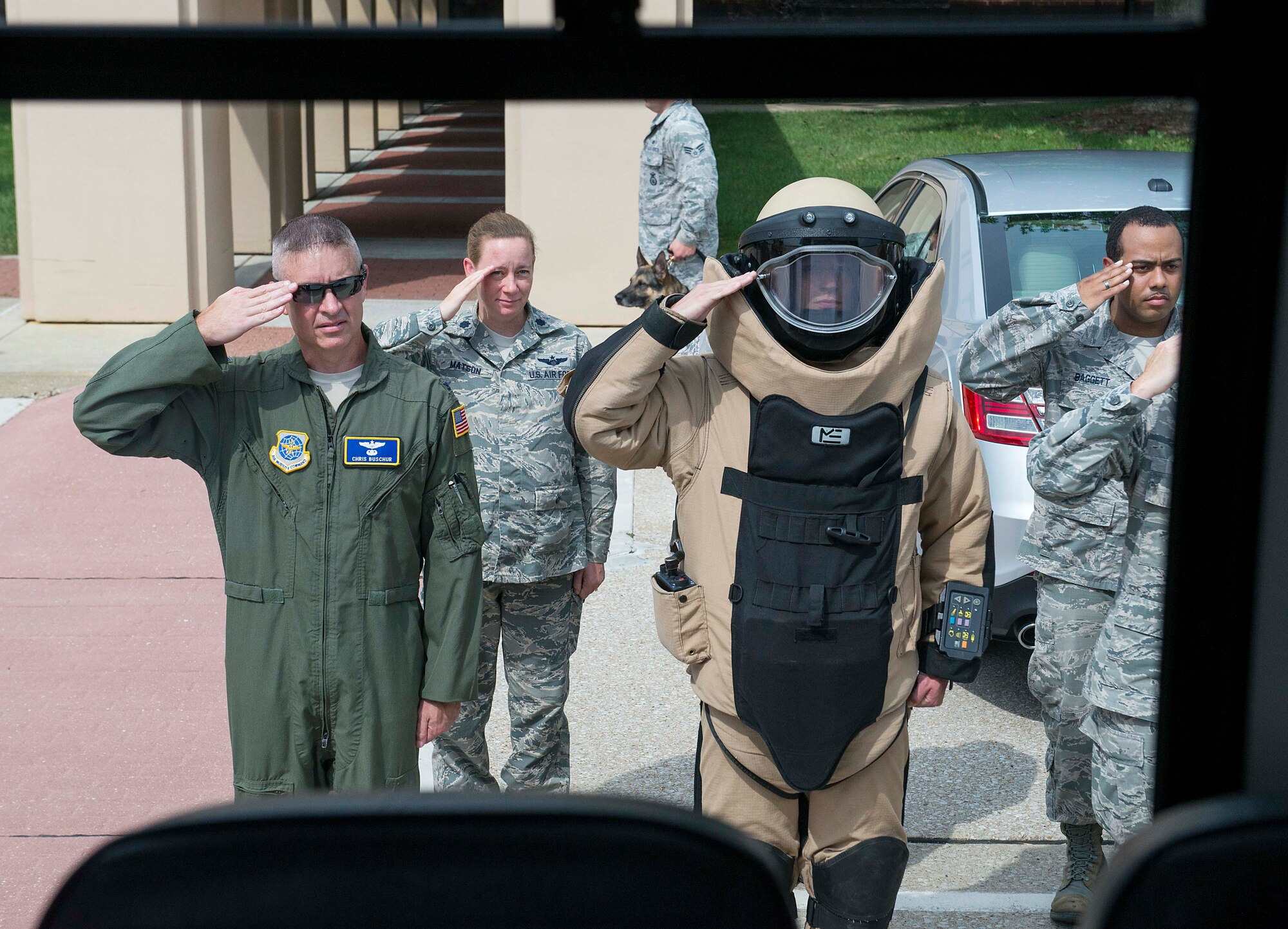 Col. Chris Buschur, 375th Air Mobility Wing vice commander, Lt. Col. Brooke Matson, 375th Operations Support Squadron, Senior Airman Derek Wingler, 375th Civil Engineer Squadron, and Staff Sgt. Justin Baggett, 375th OSS, salute as Hayden Brown, 6, goes by, Aug. 17, 2016, Scott Air Force Base, Ill. Scott Airmen teamed up with Alton VFW Post 1308 to present Hayden with a badge of courage for his determination in dealing with his rare, and terminal illness, known as MLD.  (U.S. Air Force photo by Senior Airman Megan Friedl)