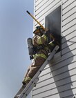 FORT MCCOY, Wis. – U.S. Army Reserve firefighter, Rochelle, Ill., native, Spc. Rachel Bunger from the 923rd Firefighter Detachment, Sturtevant, Wis., uses a pike pole to test the durability of the floor before entering to conduct a search and rescue operation during an exercise at Fort McCoy, Aug. 21, 2016. (U.S. Army Reserve Photo by Sgt. Quentin Johnson, 211th Mobile Public Affairs Detachment/Released)