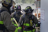FORT MCCOY, Wis. – U.S. Army Reserve firefighters from the 237th Firefighter Detachment, Sturtevant, Wis., prepare to enter the burn house to put out a fire during an exercise at Fort McCoy, Aug. 21, 2016. The training helped firefighters find weaknesses in their techniques, while learning new ones. (U.S. Army Reserve Photo by Sgt. Quentin Johnson, 211th Mobile Public Affairs Detachment/Released)