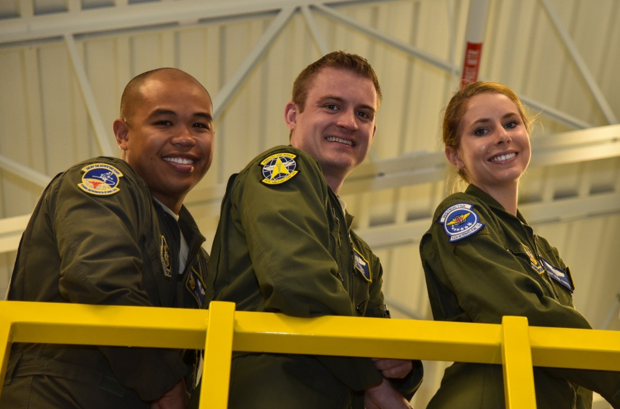1st Lt. Mark Galera aeromedical evacuation flight nurse, Staff Sgt. Ryan Schiemo and Tech. Sgt. Marie Carrol, aeromedical evacuation technicians pose for a photo August 21, 2016, at Minneapolis Air Reserve Station, Minnesota. The three Citizen Airmen responded to a motorcycle accident August 10, utilizing the skills they've acquired through their Air Force Reserve and civilian careers, secured the scene and stabilized the victim of the crash until paramedics arrived to transport the him to the hospital. (U.S. Air Force photo by Staff Sgt. Adam C. Borgman)
