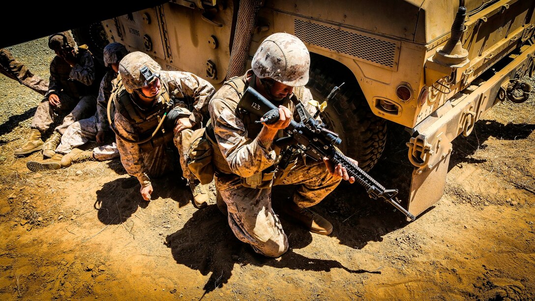 U.S. Marine with the 1st Marine Logistics Group, Combat Skills Training School use radios to communicate with other Marines as part of the Tactical Convoy Course at Camp Pendleton, Calif.,  Aug. 19, 2016. The purpose of the Tactical Convoy Course training is to teach procedures to counter threats and mitigate risks to Marine forces conducting tactical convoys. (U.S. Marines photo by LCpl. Salmineo Sherman Jr./released)