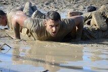 Airman 1st Class Jordan Hrkack, member of the 741st Missile Security Forces Squadron Tactical Response Force team, completes a team pushup during the Ace’s Cop Combat Challenge Aug. 19, 2016, at Malmstrom Air Force Base, Mont. Airmen who competed in the challenge had to do as many rounds of four, four-man pushups and eight tire flips as possible in fifteen minutes time to score points. (U.S. Air Force photo/Airman 1st Class Magen M. Reeves)