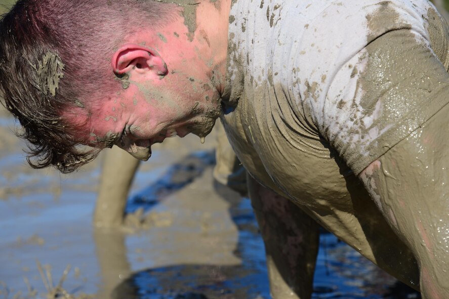 An Airman assigned to the 341st Security Forces Group, completes a four-man pushup during the Ace’s Cop Combat Challenge Aug. 19, 2016, at Malmstrom Air Force Base, Mont. Competitors had to complete multiple feats in order to place in various categories to win awards including four-man pushups, a Humvee pull and buddy-carries. (U.S. Air Force photo/Airman 1st Class Magen M. Reeves)