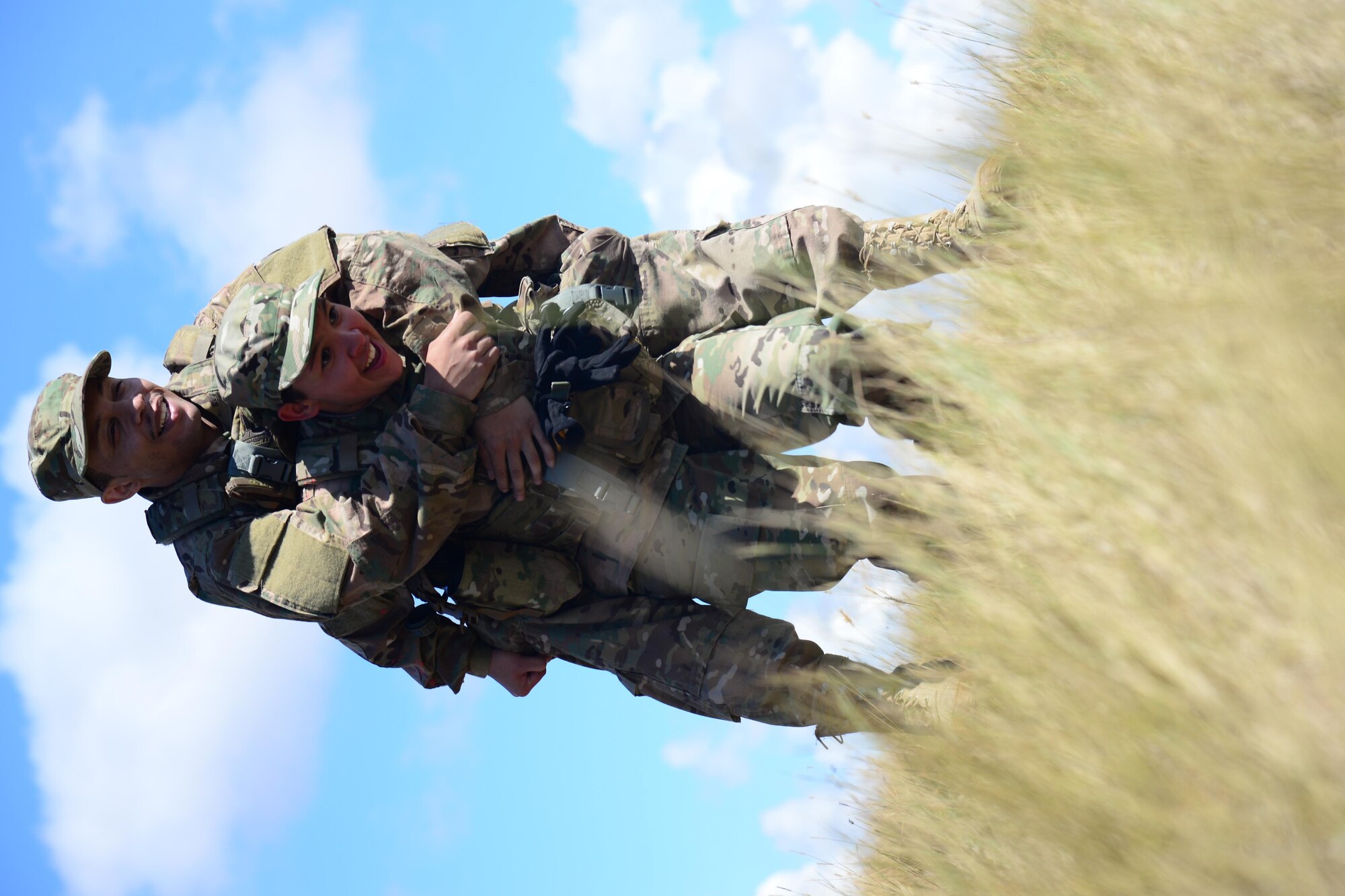 Airmen assigned to the 341st Security Forces Group, complete a buddy-carry event during the Ace’s Cop Combat Challenge Aug. 19, 2016, at Malmstrom Air Force Base, Mont. Competitors had to complete multiple feats in order to place in various categories to win awards. (U.S. Air Force photo/Airman 1st Class Magen M. Reeves)
