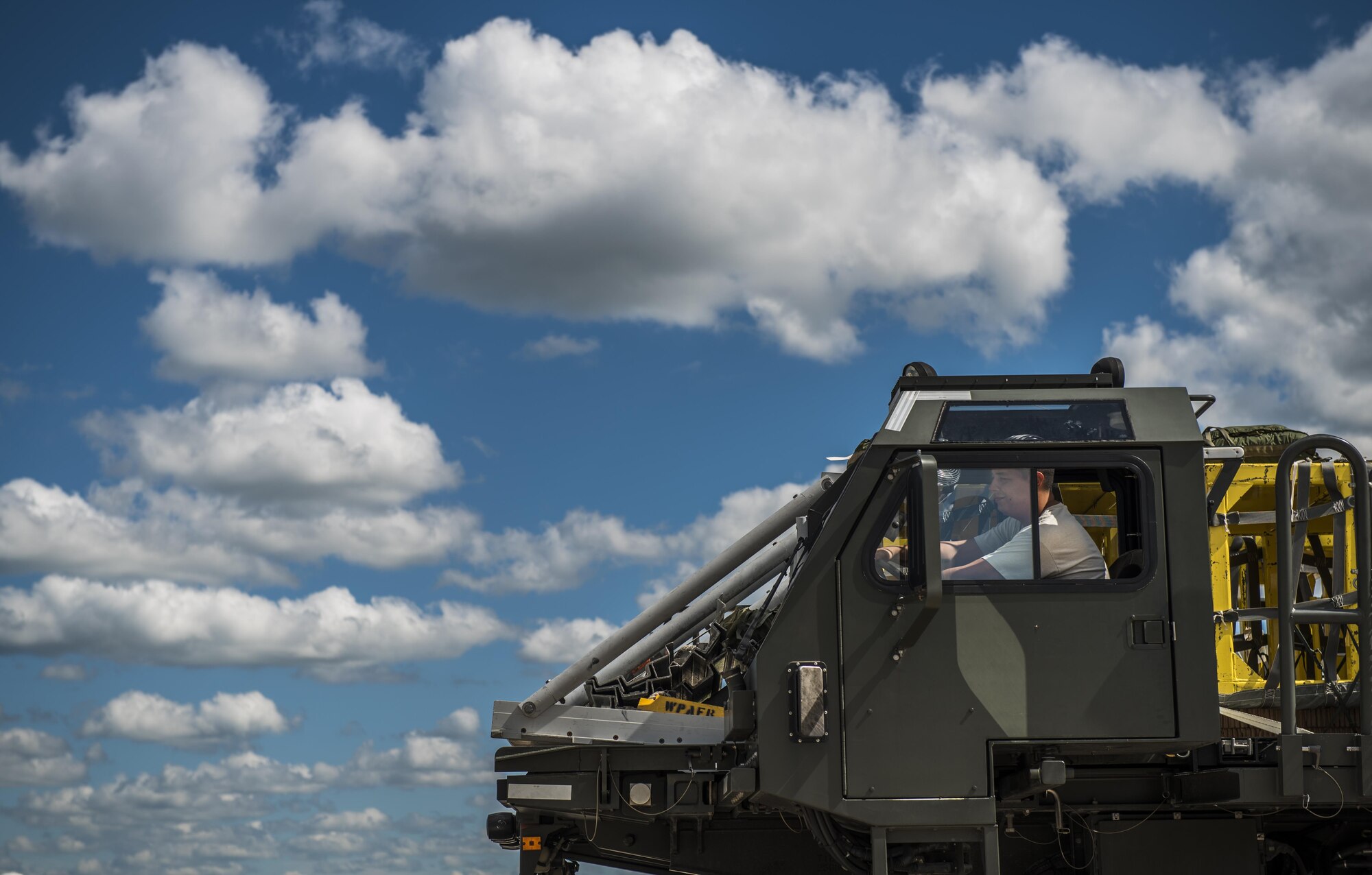 Senior Airman Alexander Chenard, an aerial delivery journeyman, prepares to load a MC-130H Combat Talon II for a mass container delivery system exercise during Task Force Exercise Olympus Archer at Wright Patterson Air Force Base, Ohio, Aug. 21, 2016. Olympus Archers focus is to maximize training opportunities for more than 230 Air Commandos with the 1st Special Operations Wing with an emphasis on medical operations in conjunction with flying operations. (U.S. Air Force photo by Staff Sgt. Christopher Callaway)