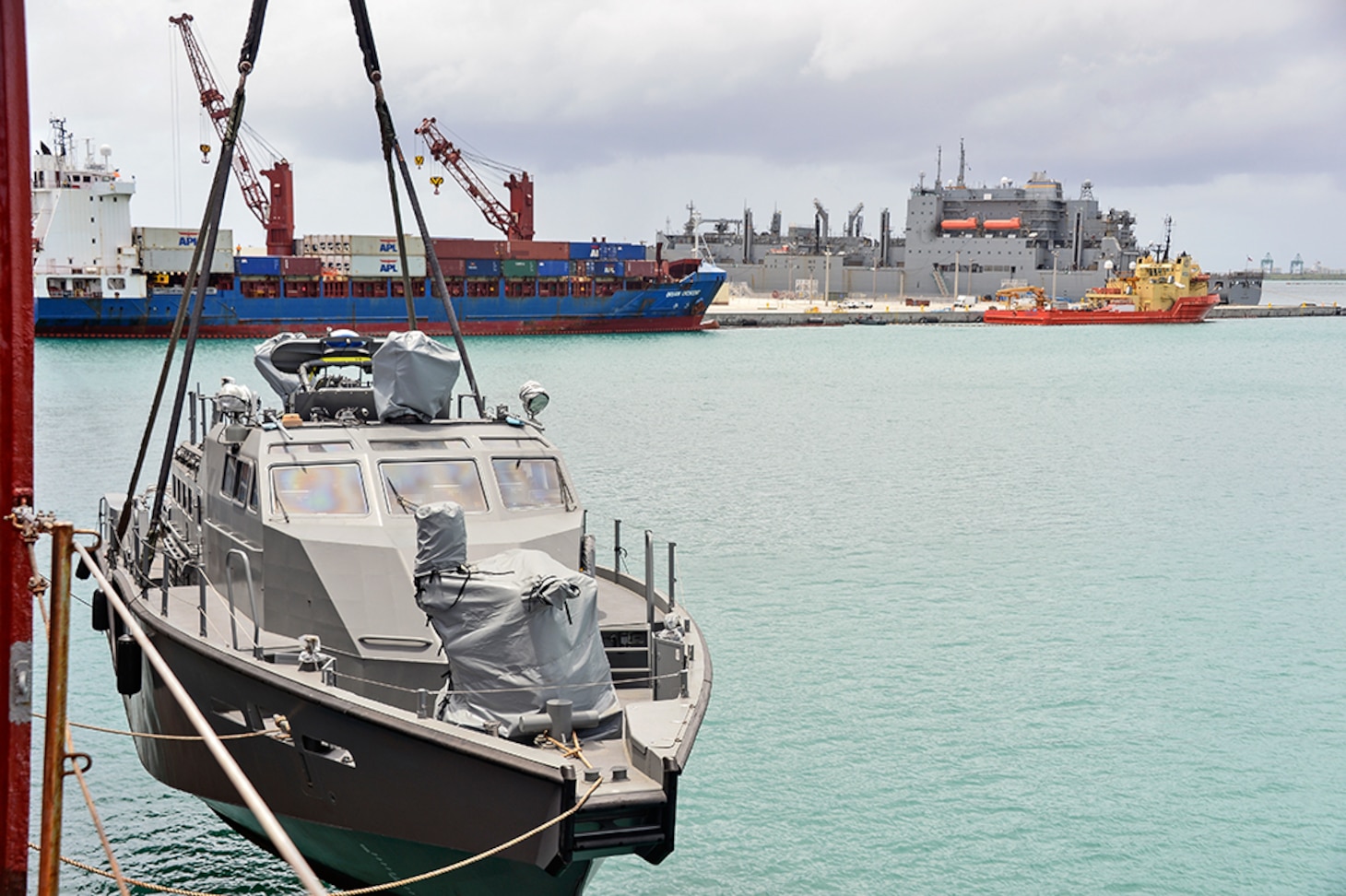The Mark VI Patrol Boat, assigned to Coastal Riverine Group One, Detachment Guam (CRG-1 Det Guam) is offloaded at Naval Base Guam.  CRG-1 Det Guam is assigned to Commander, Task Force 75, the primary expeditionary task force responsible for the planning and execution of coastal riverine operations, explosive ordnance disposal, diving engineering and construction, and underwater construction in the U.S. 7th fleet area of operations. 