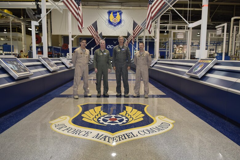 Members of the 307th Bomb Wing, Air Force Reserve Command, visited Team Tinker on Aug. 17, 2016, to learn about how the B-52H aircraft they fly are maintained by the Oklahoma City Air Logistics Complex, Tinker Air Force Base, Okla. Shown inside the Oc-ALC are: Maj. Nathan Barnhart, 343rd Bomb Squadron, B-52H radar navigator/weapon system officer, Col. Trey Morriss, 307th BW vice commander, Col. Rob Burgess, 307th Operations Group commander, and Maj. Aaron Bohl, 343rd Bomb Squadron, B-52H pilot. (U.S. Air Force photo/Greg L. Davis)