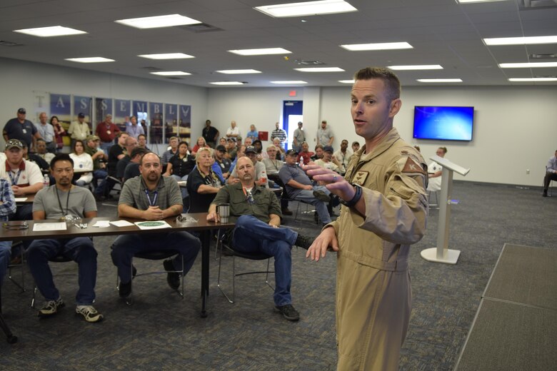 Maj. Aaron Bohl, 343rd Bomb Squadron, B-52 pilot, speaks to members of the 551st Commodities Maintenance Squadron and other Team Tinker personnel gathered in the Oklahoma City Air Logistics Complex, about his recent deployment in support of Operation Inherent Resolve and how the B-52H aircraft he flew performed in combat on Aug. 17, 2016, Tinker Air Force Base, Okla. The 551st CMMXS repairs major components of the B-52H operated by the 343rd BS, 307th Bomb Wing, Air Force Reserve Command.  (U.S. Air Force photo/Greg L. Davis)