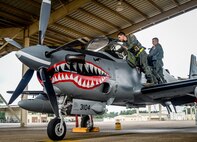Colombian and U.S. Air Force pilots perform a pre-flight check during before a sortie at Exerise Green Flag East at Barksdale Air Force Base, La., Aug. 17, 2016. Green Flag East allows pilots to train in a simulated, high-threat environment, and provides maintenance and support personnel an increased tempo in generating fully mission-capable combat aircraft. (U.S. Air Force photo / Senior Airman Mozer O. Da Cunha)