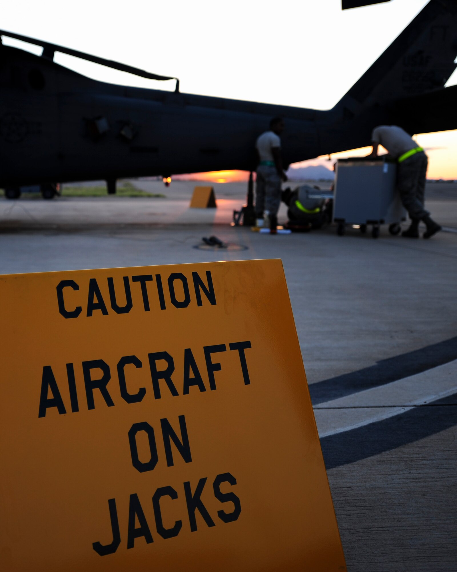 U.S. Airmen from the 923d Aircraft Maintenance Squadron perform maintenance on an HH-60G Pave Hawk at Davis-Monthan Air Force Base, Ariz., Aug. 23, 2016. The 923d AMXS rapidly mobilizes and deploys aircraft, equipment and forces to provide combat and peacetime personnel recovery operations in support of U.S. national security interests. (U.S. Air Force photo by Airman Nathan H. Barbour)