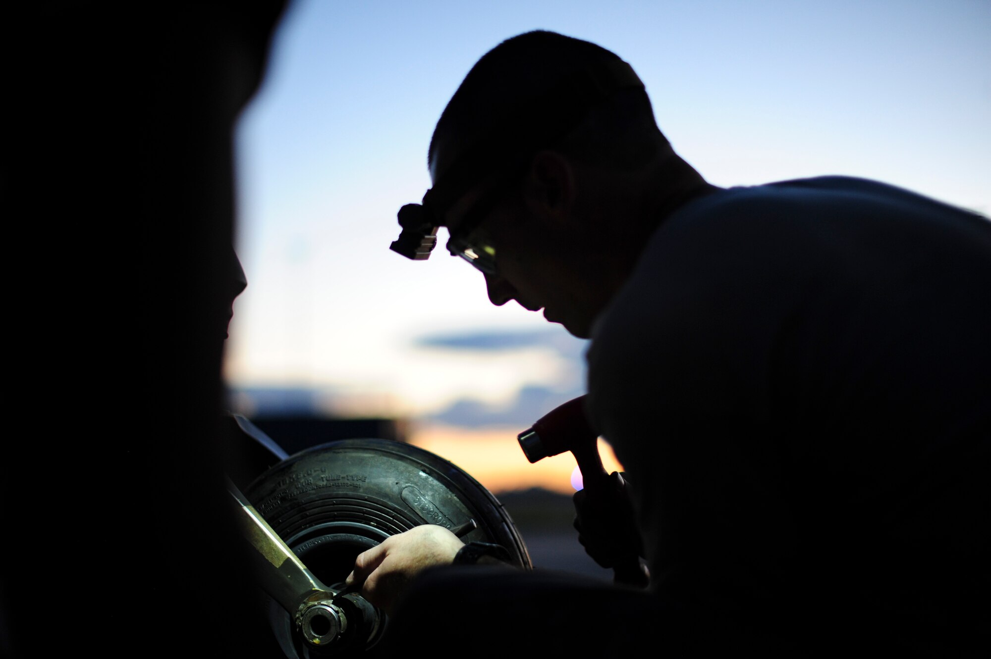U.S. Air Force Staff Sgt. Gage, 923d Aircraft Maintenance Squadron crew chief, changes a tire on an HH-60G Pave Hawk at Davis-Monthan Air Force Base, Ariz., Aug. 23, 2016. The 923d AMXS provides direct maintenance support for the 79th Rescue Squadron, 55 RQS and 48 RQS Guardian Angels. (U.S. Air Force photo by Airman Nathan H. Barbour)
