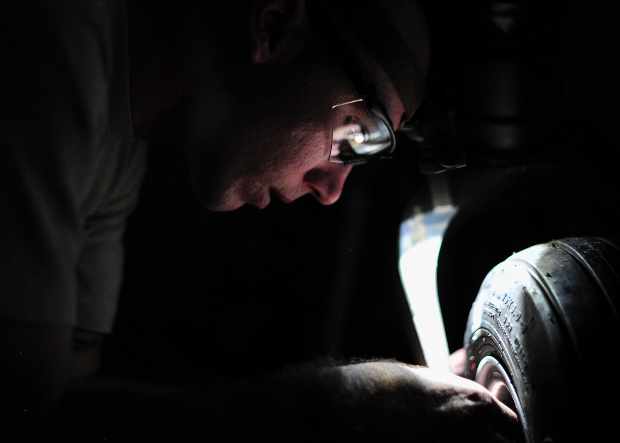 U.S. Air Force Staff Sgt. Gage, 923rd Aircraft Maintenance Squadron crew chief, changes a tire on an HH-60G Pave Hawk at Davis-Monthan Air Force Base, Ariz., Aug. 23, 2016. The 923 AMXS ensures rapid mobilization of HH-60 and HC-130J aircraft and forces to support combat search and rescue operations. (U.S. Air Force photo by Airman Nathan H. Barbour)