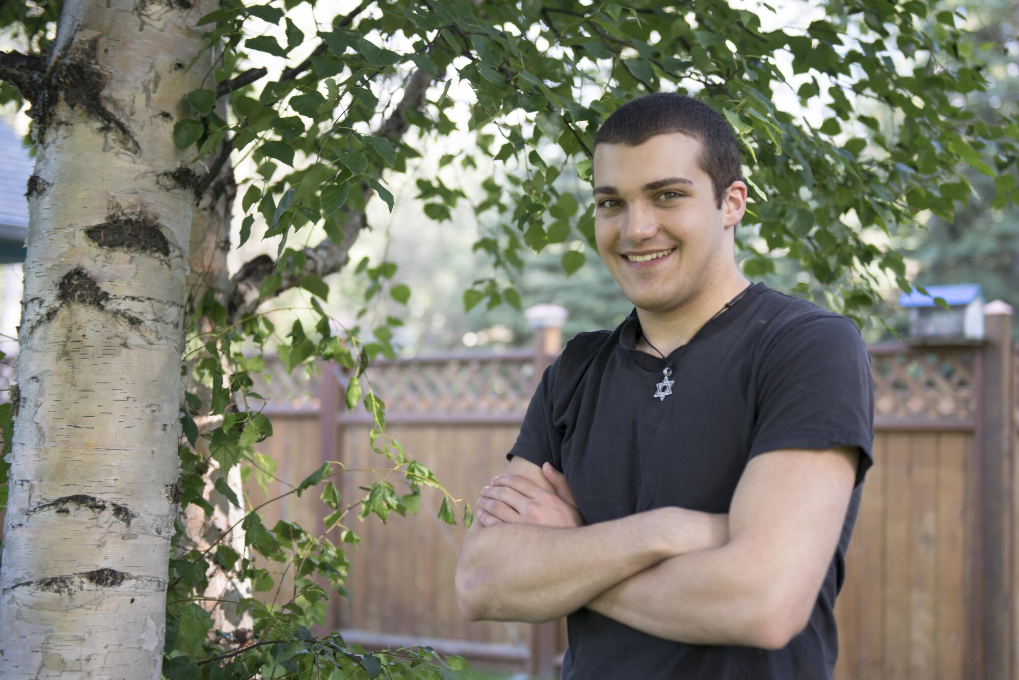 Robert Waid takes a break outside of his home in North Pole, Alaska, after making some of his artwork, July 25, 2016. Waid was diagnosed with autism at the age of 8, but channels his energy toward creating art he sells throughout the local area. (U.S. Air Force photo by Staff Sgt. Ashley Nicole Taylor)