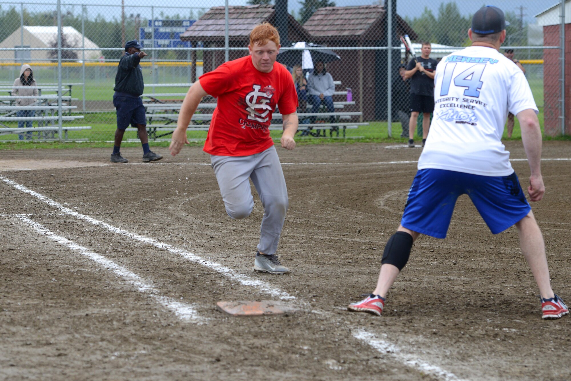 Ryan Barton races to first base at the baseball field near Buckner Physical Fitness Center at Joint Base Elmendorf-Richardson, Alaska, during the intramural softball playoffs, Aug. 17, 2016. The intramural softball 2016 season started May 16. Thirty-eight teams, split between two divisions played 18 games each during the regular season. (U.S. Air Force photo by Airman 1st Class Javier Alvarez)