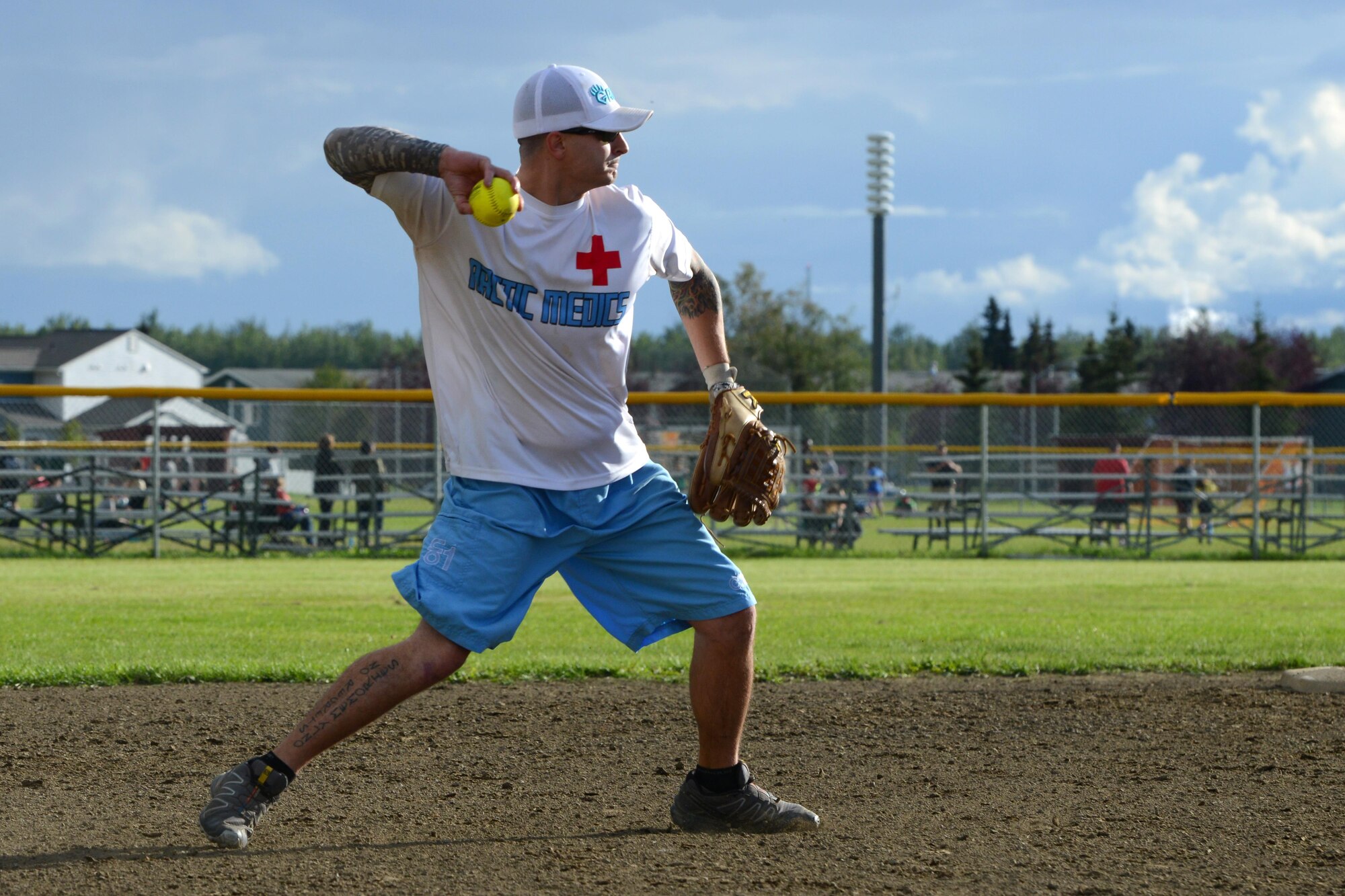 Andrew Taylor throws the softball to first base for the out at the baseball field behind Buckner Physical Fitness Center, at Joint Base Elmendorf-Richardson, Alaska, Aug. 18, 2016. The Arctic Medics with the 673d Medical Group were undefeated in the 2016 season. (U.S. Air Force photo by Airman 1st Class Javier Alvarez)