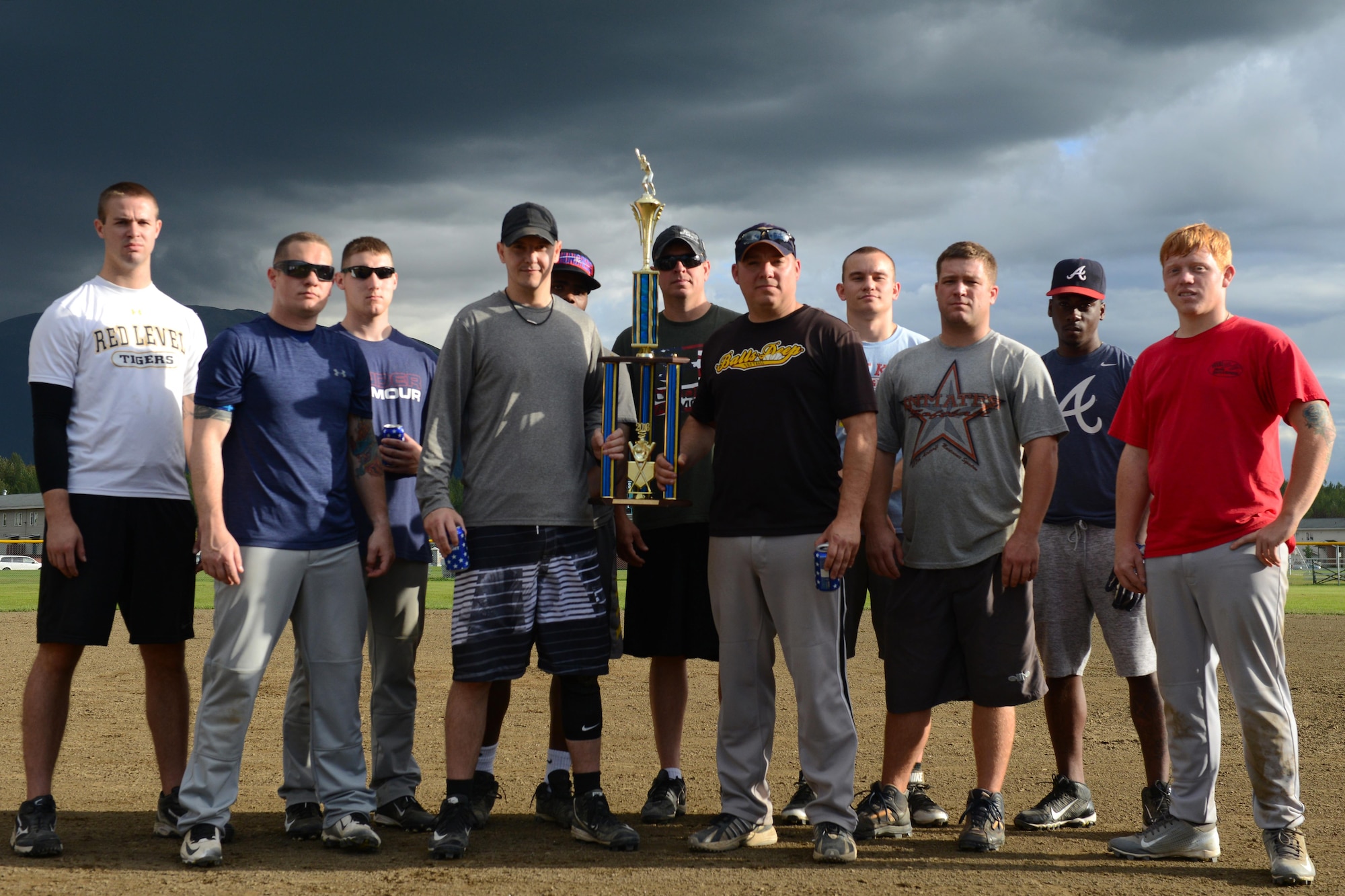 Players on the 703d Aircraft Maintenance Squadron softball team stand on the pitcher’s mound after being awarded the second place trophy at the baseball field behind Buckner Physical Fitness Center, at Joint Base Elmendorf-Richardson, Alaska, Aug. 18, 2016. Thirty-eight teams participated in the intramural softball 2016 season. Each team played 18 games in the regular season. Eight teams with the best record made it to the playoffs. (U.S. Air Force photo by Airman 1st Class Javier Alvarez)
