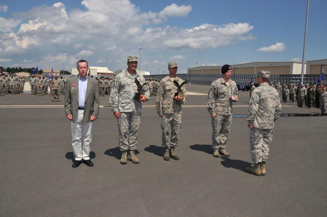 Col. Edward J. Gunning Jr., receives the Legion of Merit for the successful stand up of the Northeast aerospace alert mission, Chief Master Sgt. Robert Roy, Air Control Alert Superintendent, accepts 2015 Continental United States North American Aerospace Defense Command Region / 1st Air Force Air Control Alert Unit of the Year Award for the Wing, Sgt. Trevor Tompkins, receives 2015 Air Forces North Air Control Alert Maintainer of the Year, and Staff Sgt. Shane Coakley, receives Massachusetts Air National Guard Non-Commissioned officer of 2016 (Left to Right) during the 104th Fighter Wing Awards Ceremony. Coakley deployed to Kandahar Air Field, Afghanistan in support of Operation Enduring Freedom and Operation Freedom Sentinel. (U.S. Air National Guard Photo by Tech Sgt. Melanie Casineau)