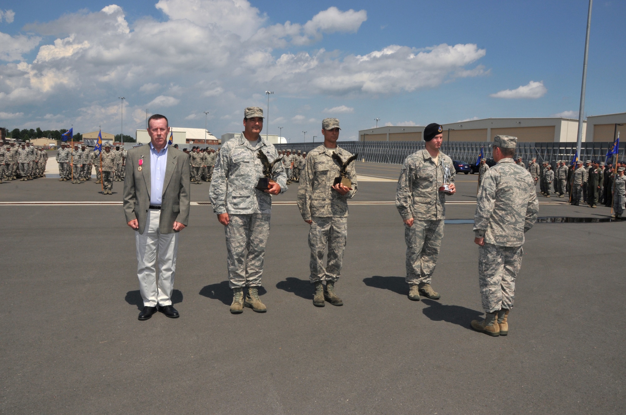 Col. Edward J. Gunning Jr., receives the Legion of Merit for the successful stand up of the Northeast aerospace alert mission, Chief Master Sgt. Robert Roy, Air Control Alert Superintendent, accepts 2015 Continental United States North American Aerospace Defense Command Region / 1st Air Force Air Control Alert Unit of the Year Award for the Wing, Sgt. Trevor Tompkins, receives 2015 Air Forces North Air Control Alert Maintainer of the Year, and Staff Sgt. Shane Coakley, receives Massachusetts Air National Guard Non-Commissioned officer of 2016 (Left to Right) during the 104th Fighter Wing Awards Ceremony. Coakley deployed to Kandahar Air Field, Afghanistan in support of Operation Enduring Freedom and Operation Freedom Sentinel. (U.S. Air National Guard Photo by Tech Sgt. Melanie Casineau)